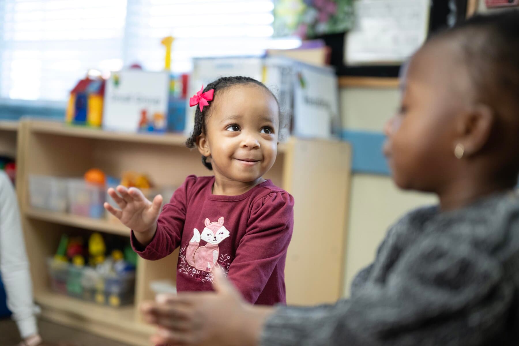 toddler child smiling and clapping