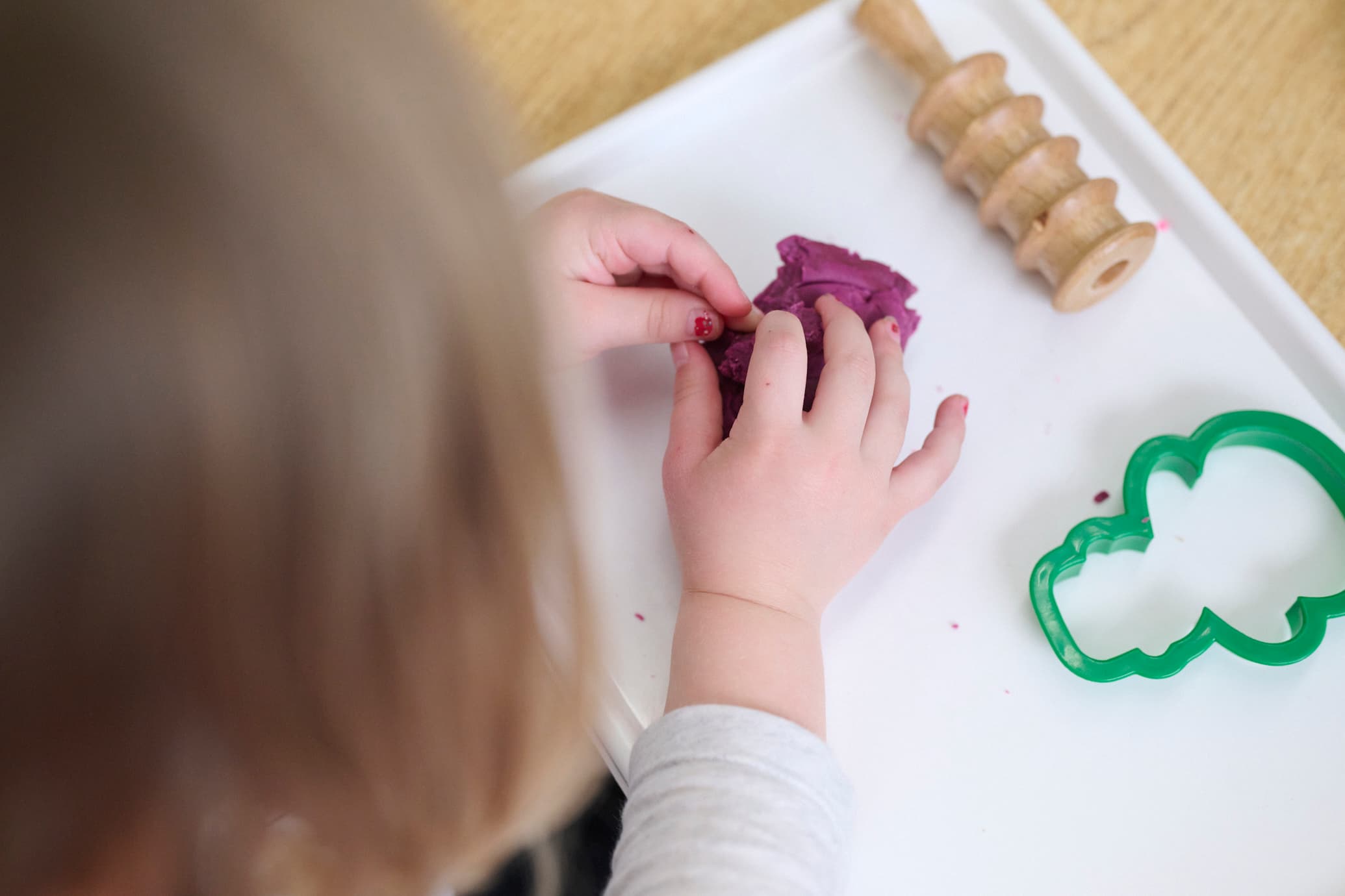 child playing with play dough